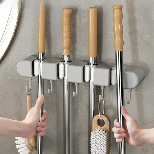 Mivoza wall-mounted broom and mop holder for secure, space-saving storage of cleaning tools in home organization.