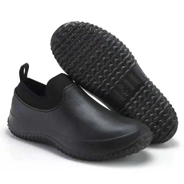 Black Belro waterproof slip-on work shoes, durable footwear designed for safety and comfort in industrial environments.