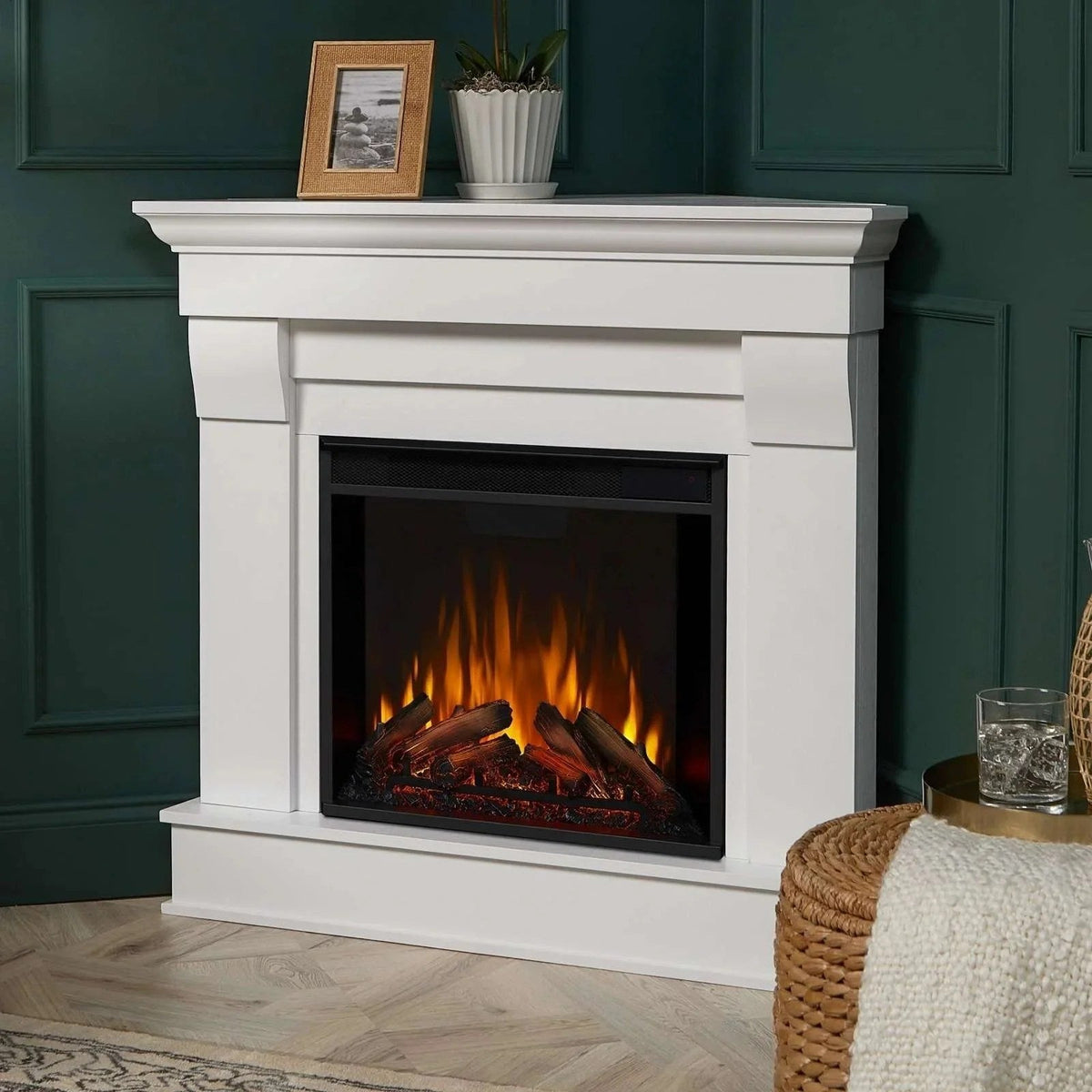 Casavibeo Real Flame Chateau Corner Electric Fireplace showing a cozy corner setup with realistic flame effects and wood-like interior.