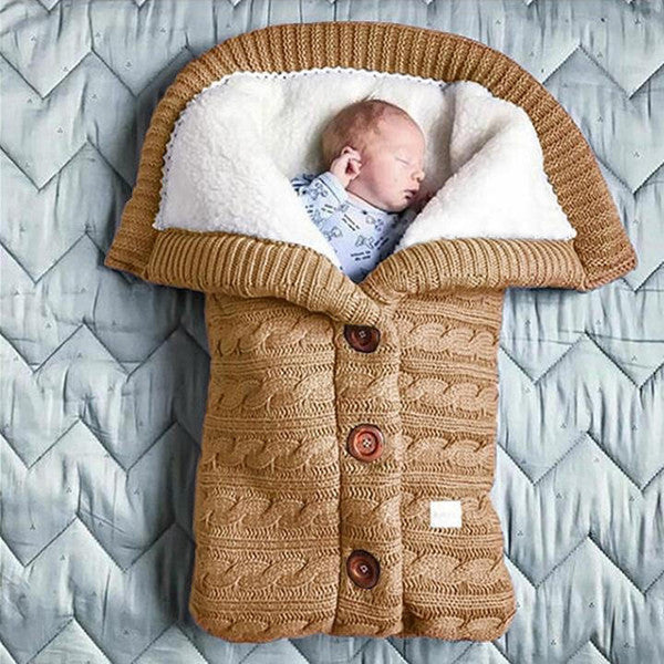 Soft baby blanket by Belro with pastel colors and cozy texture, ideal for nursery bedding and warmth.