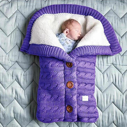Soft Belro baby blanket in cozy fabric, shown draped on a bed, ideal for newborns and infants.