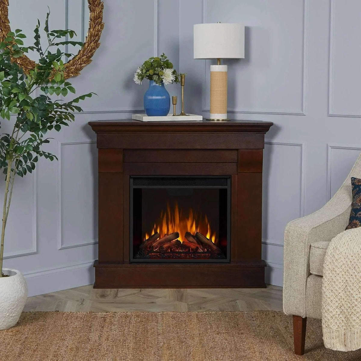 Casavibeo Real Flame Chateau Corner Electric Fireplace showing a cozy, modern corner fireplace with realistic flame effects and wood mantel