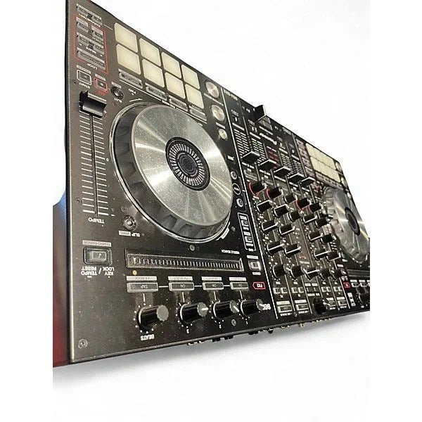 Used Pioneer DJ DDJSX2 DJ controller with dual jog wheels, control knobs, and colorful LED lighting for professional DJ mixing.