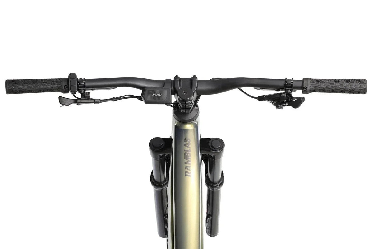 Casavibeo Aventon Ramblas eMTB shown with sleek frame, battery, and mountain bike tires on a scenic trail.