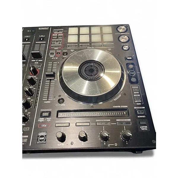 Used Pioneer DJ DDJSX2 DJ controller with multiple knobs and jog wheels, displayed on a white surface.
