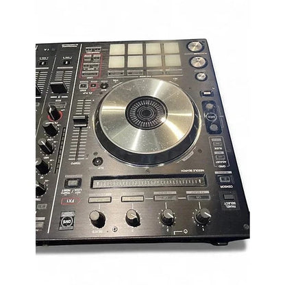 Used Pioneer DJ DDJSX2 DJ controller with multiple knobs and jog wheels, displayed on a white surface.