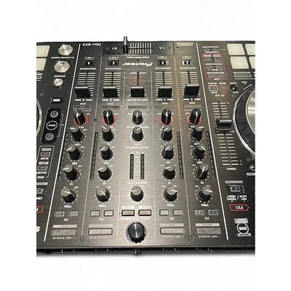 Used Pioneer DJ DDJSX2 DJ controller with multiple jog wheels, buttons, and sliders, set on a black surface.