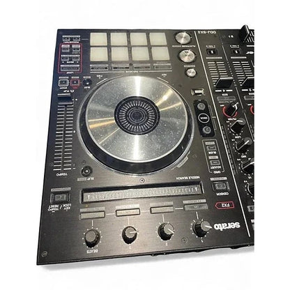 Used Pioneer DJ DDJSX2 DJ controller with jog wheels, mixer, and controls, shown in a casual setup.