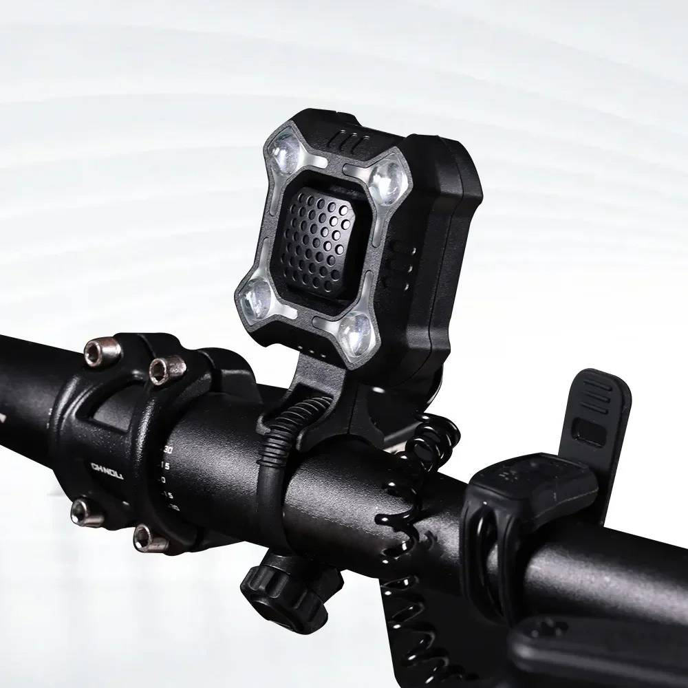 Belro bike bell and light mounted on a bicycle handlebar, outdoor setting, showcasing the product's compact design and functionality.
