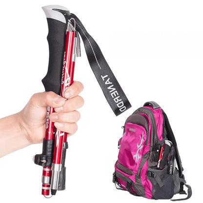 BowLift adjustable trekking poles, lightweight foldable hiking sticks with telescopic design, shown in a natural outdoor setting.