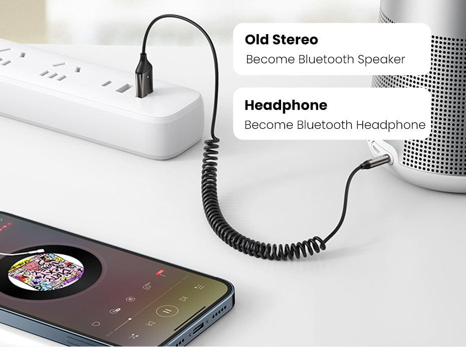 Belro Bluetooth Aux Adapter connected to an audio device, compact electronics for wireless audio streaming.