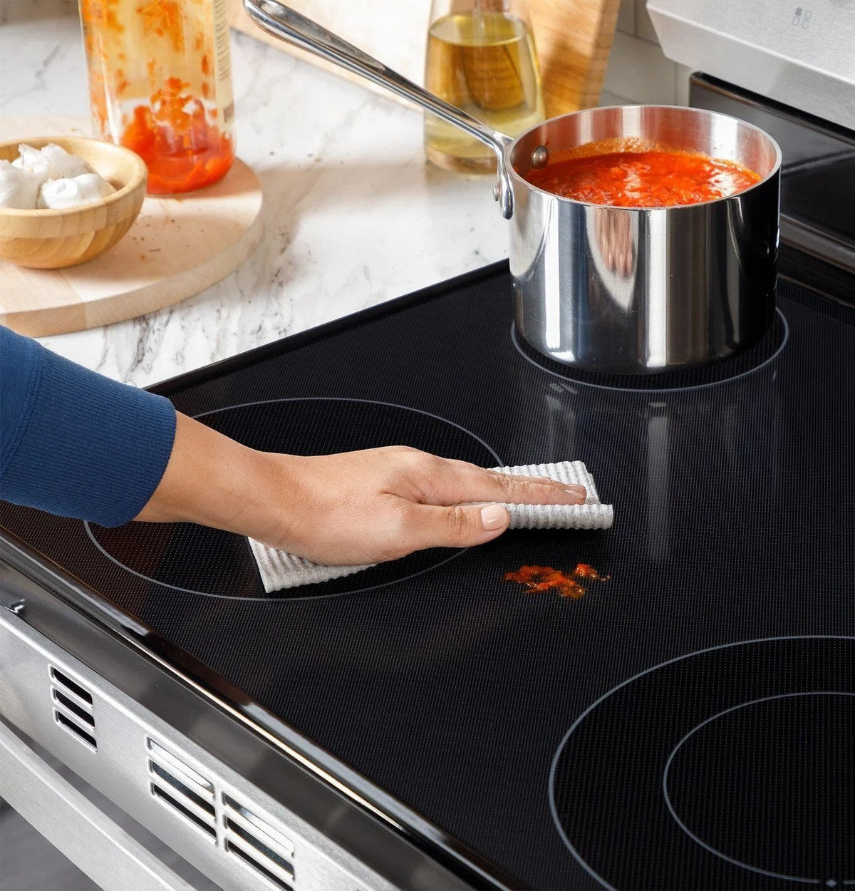 Casavibeo 30-inch freestanding electric range with four burners and digital control panel, black finish, and spacious oven interior.