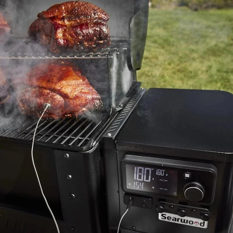 Casavibeo Weber Grills Searwood 600 Pellet Grill with stainless steel build and digital control panel, set on a patio.