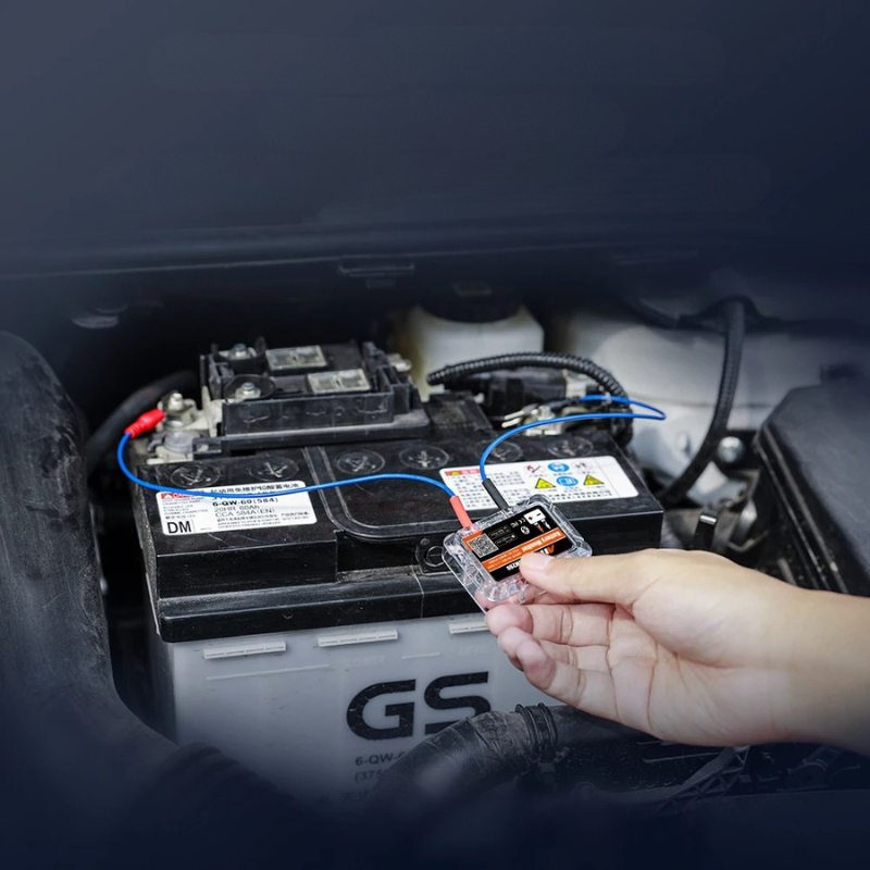 Belro Bluetooth car battery tester showing digital display and testing ports for electronic power and charging batteries.