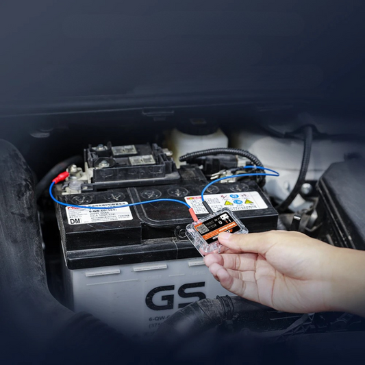 Belro Bluetooth car battery tester showing digital display and testing ports for electronic power and charging batteries.