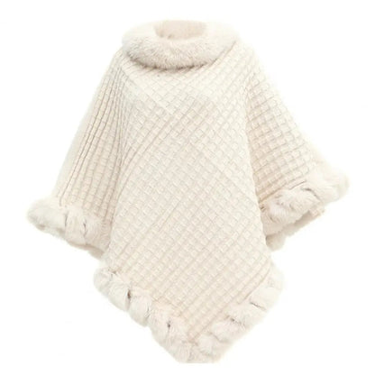 Beige faux fur shawl cloak for women by Belro, stylish and cozy outerwear for elegant winter or fall outfits.