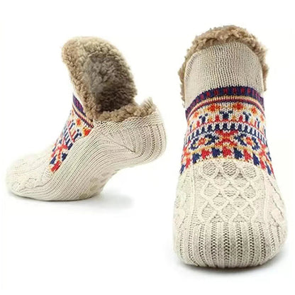 Beige knitted slipper socks with fleece lining by Belro, cozy footwear for warmth and comfort.