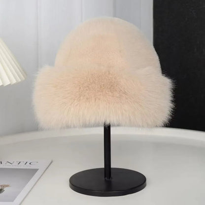 Beige women's plush winter bucket hat by Belro, cozy and warm accessory with soft fabric and wide brim.