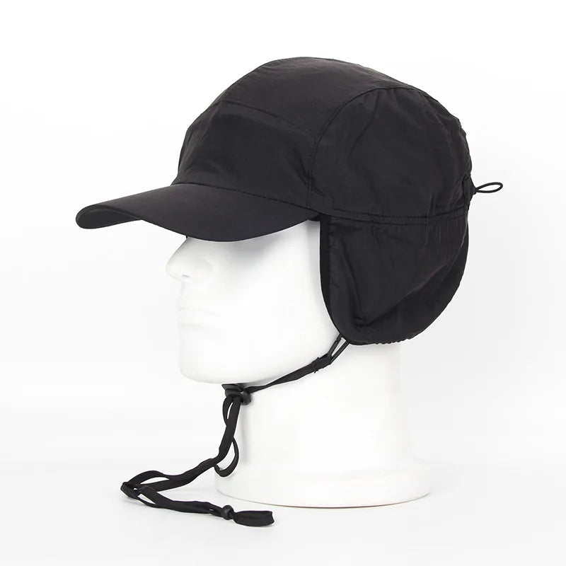 Black Belro winter bomber hat with ear flaps and cozy lining, designed for warmth and winter outdoor wear.