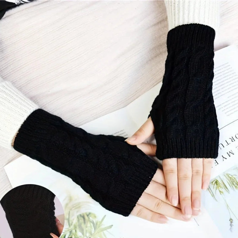Black knit women's winter fingerless gloves by Belro, cozy accessories for cold weather with a stylish design.