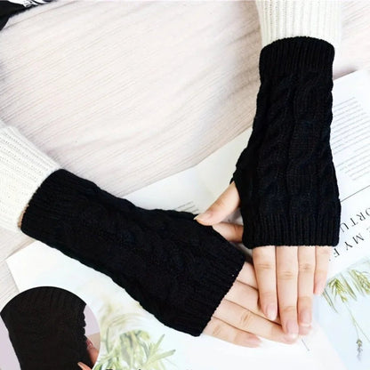 Black knit women's winter fingerless gloves by Belro, cozy accessories for cold weather with a stylish design.