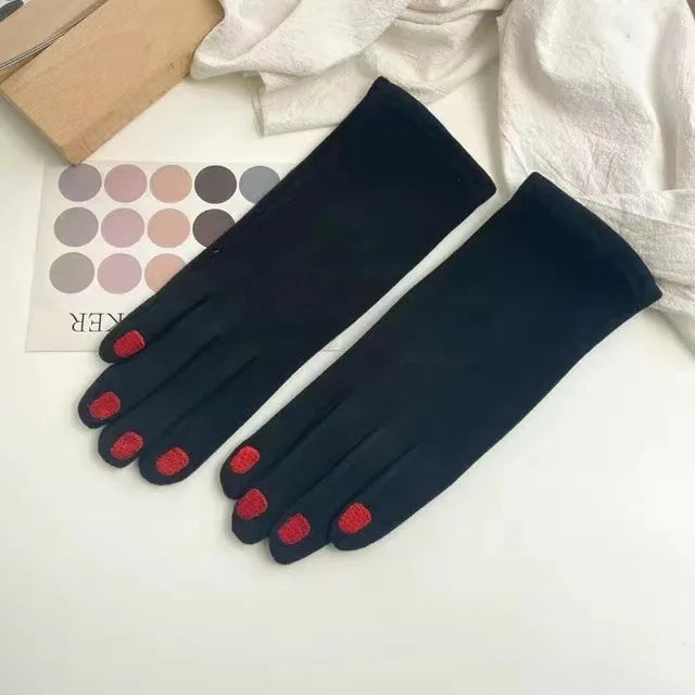 Black Belro touch screen winter gloves with nail polish design, showing close-up of stylish gloves with fingertips for touchscreen use.