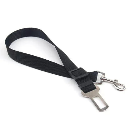 Black Belro Adjustable Dog Seat Belt attached to a car seat, designed for secure pet travel safety and comfort.