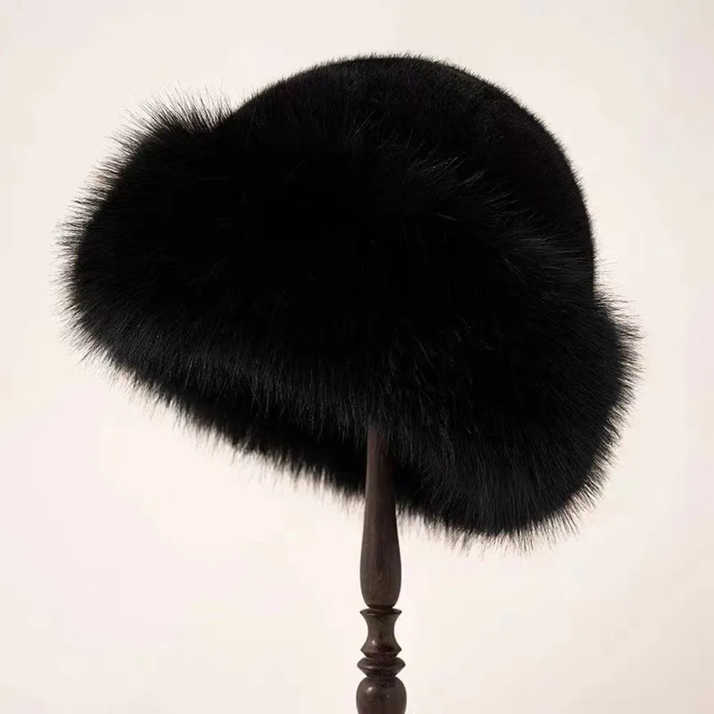 Women’s black plush winter bucket hat by Belro, cozy and stylish accessory for cold weather.