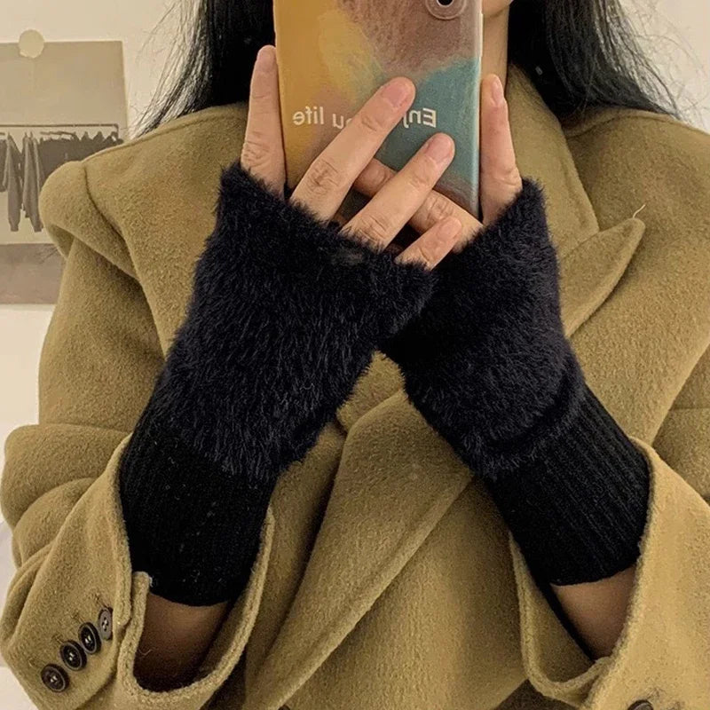 Black plush cozy fingerless gloves for women by Belro, featuring soft, warm fabric and a comfortable fit.