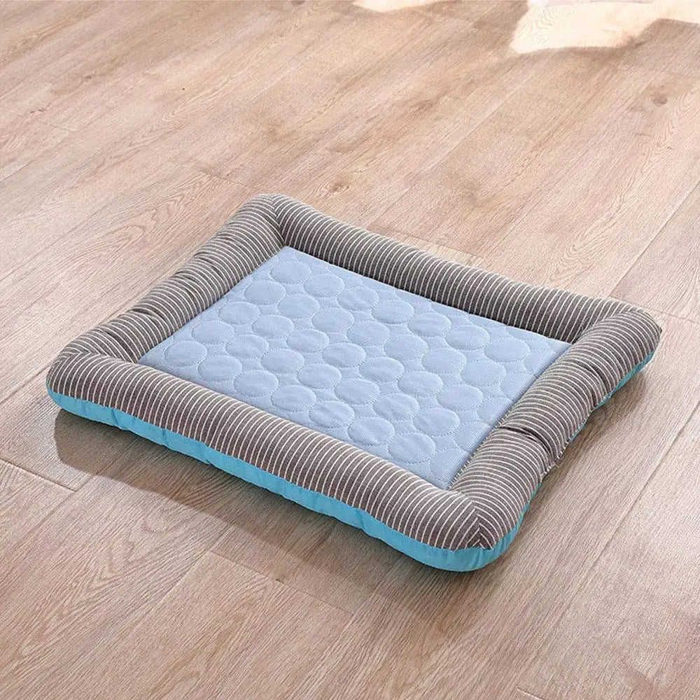 Blue Belro cooling dog bed with ice silk material, soft and comfortable pet bed for dogs in a cozy indoor setting.