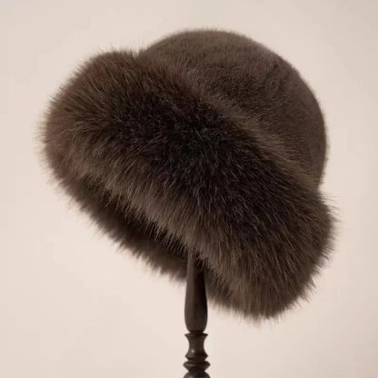 Brown women’s plush winter bucket hat by Belro with soft, cozy fabric and a classic bucket hat shape for winter accessories.