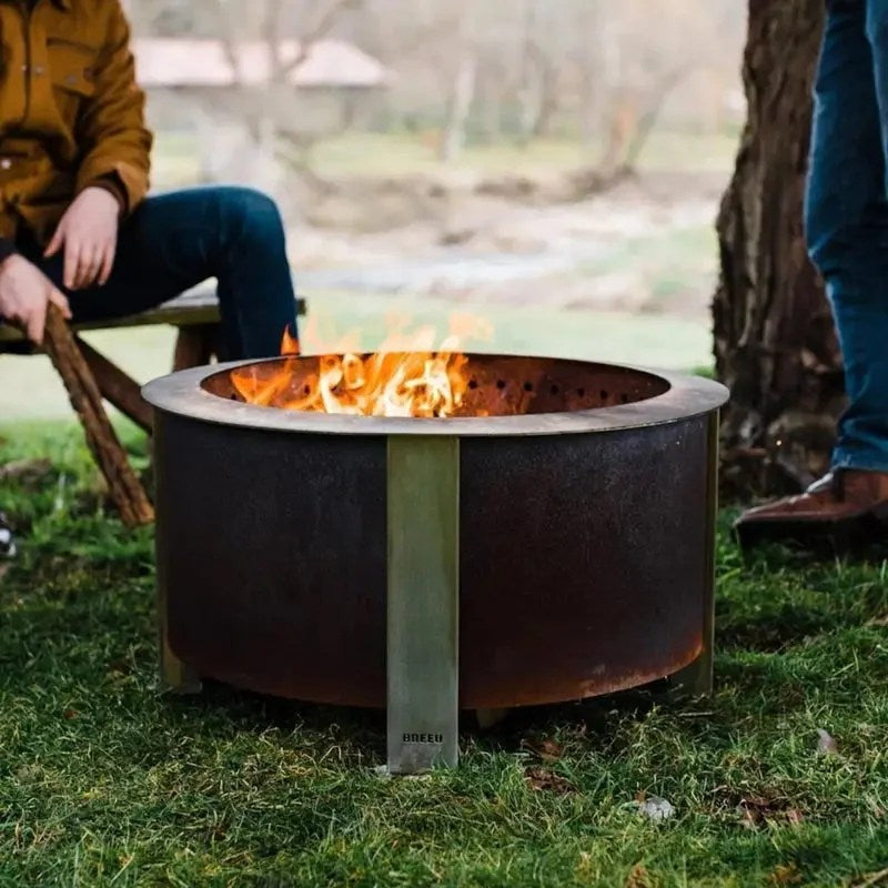 Casavibeo X Series 28-inch round cortens steel wood-burning fire pit in stainless steel with a sturdy design and open top.