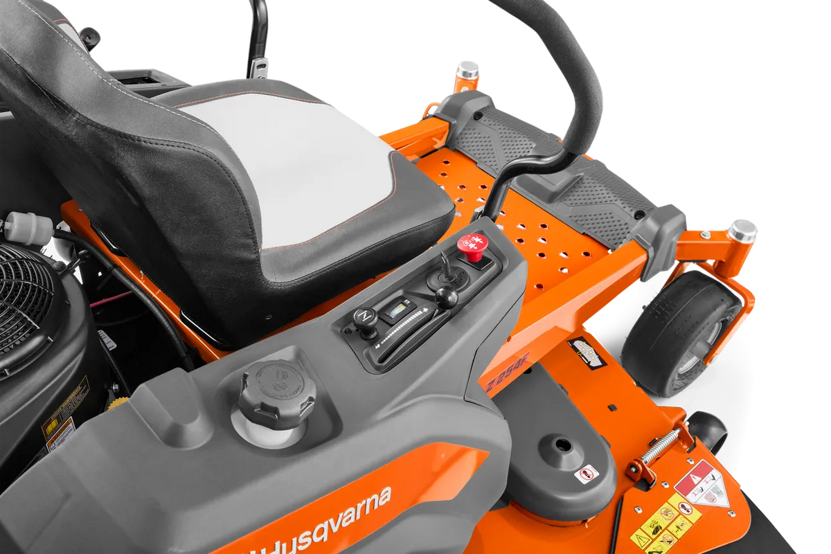 Husqvarna Z254F 54-inch zero-turn riding lawn mower with 24 HP Kawasaki engine, shown on a lush green lawn.
