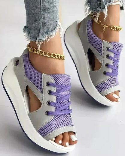 Belro contrast paneled cutout lace-up muffin sandals featuring a stylish design with open toes and ankle laces.