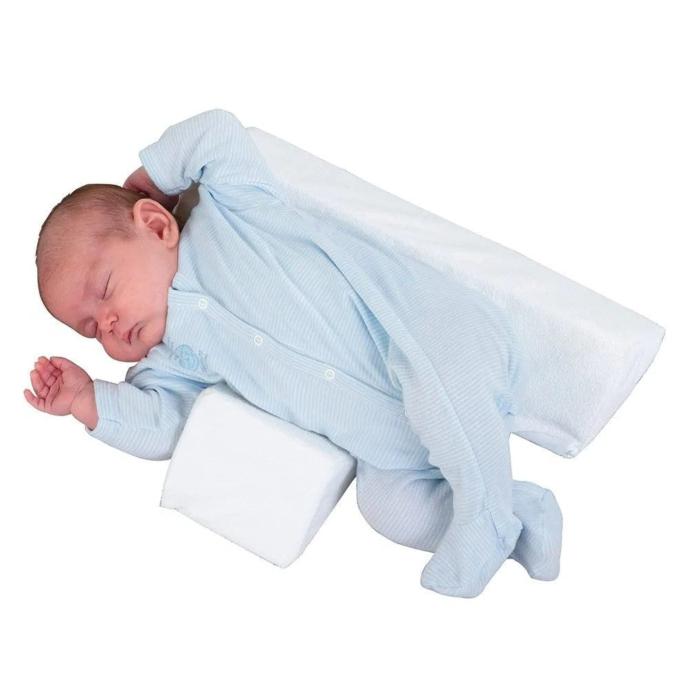 Belro baby anti-roll wedge pillow for side sleeping, providing support and comfort for infants in a home bedding setting.