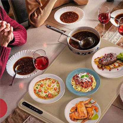 Belro electric warming tray on kitchen countertop, black rectangular appliance for keeping food warm during meals.