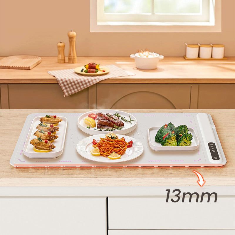 Belro electric warming tray on kitchen countertop, black rectangular electric appliance for food heating and serving.