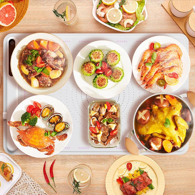 Belro electric warming tray on a kitchen countertop, perfect for keeping food warm during meals or gatherings.