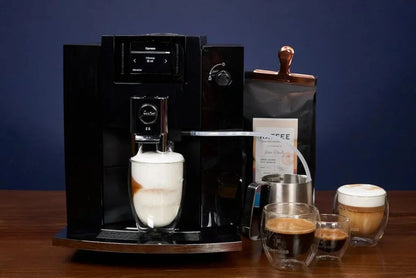 Casavibeo Jura E6 automatic coffee machine with sleek design, digital display, and built-in milk frother for espresso and coffee brewing.