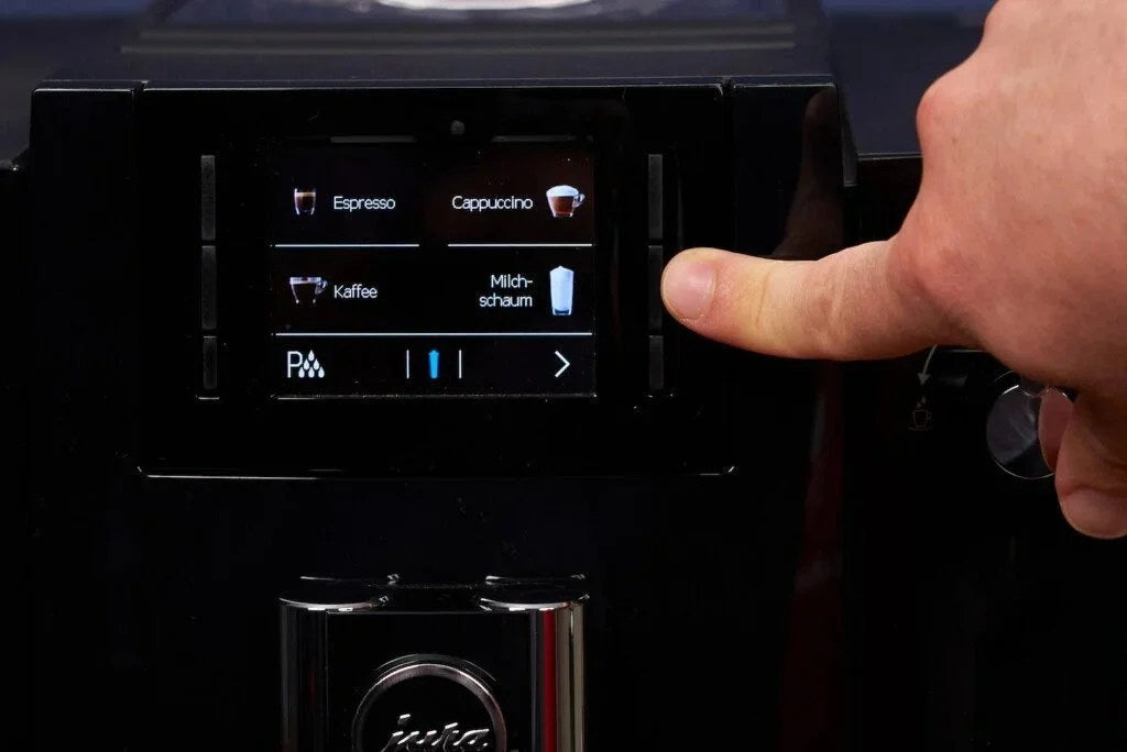 Casavibeo Jura E6 automatic coffee machine with sleek design and digital controls, ready for brewing fresh coffee.