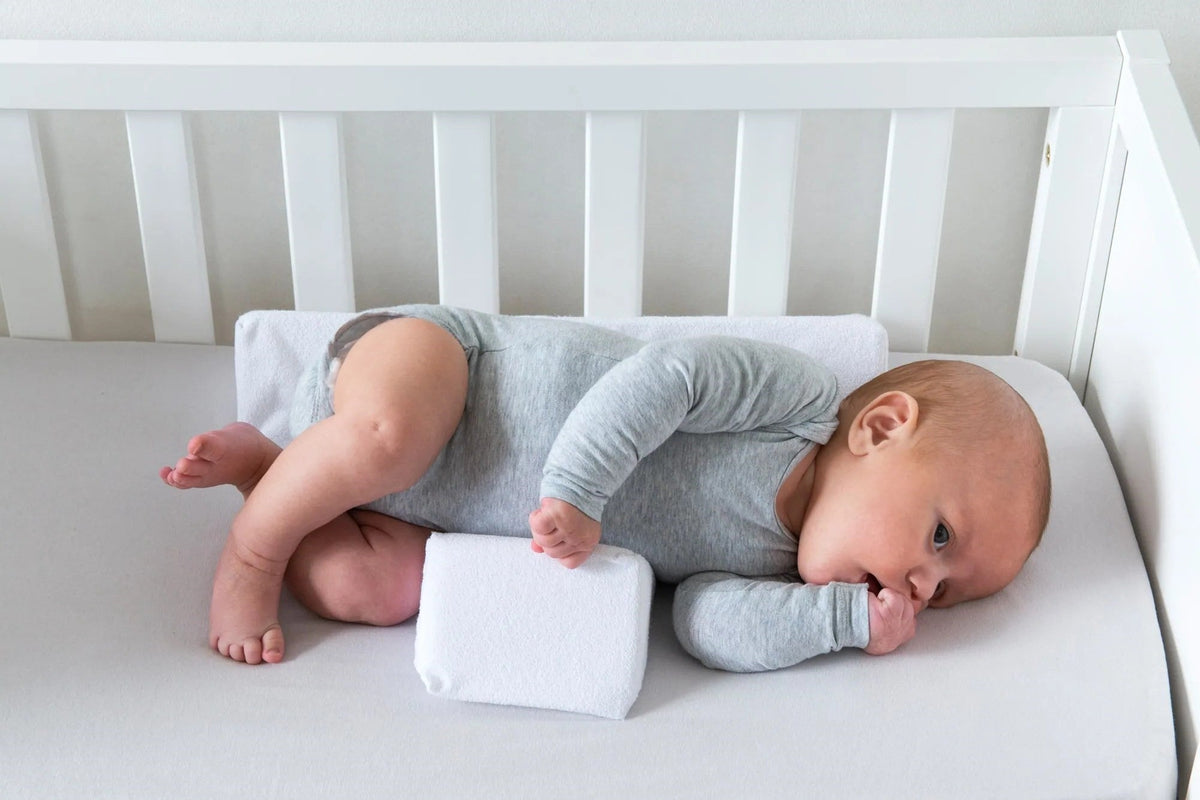 Belro Baby Anti-Roll Wedge Pillow designed for safe, comfortable positioning in home bedding and sleep setups.