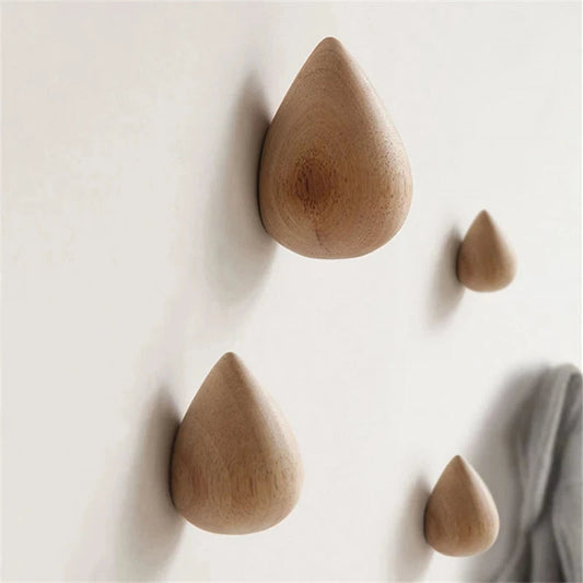 Belro beech wood water drop wall coat holder with multiple hooks for jackets and coats, mounted on a wall.