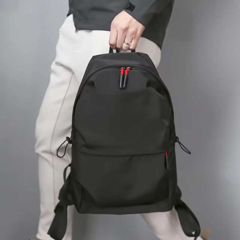 Belro minimalist black backpack designed for laptops, featuring sleek modern style and durable material for everyday carry.