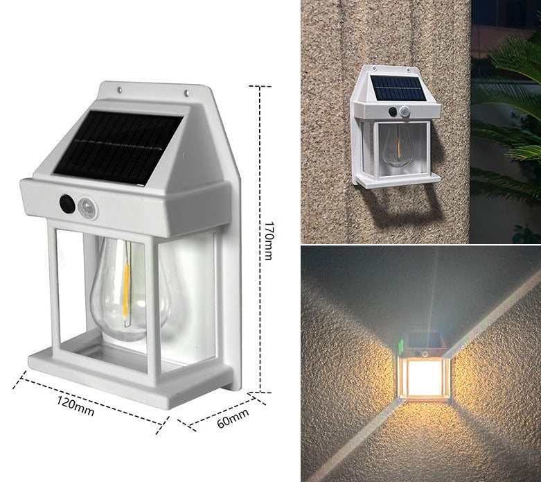Set of two Mivoza solar wall lanterns with motion sensors, auto on/off, outdoor garden lighting, mounted on a wall in a garden setting.