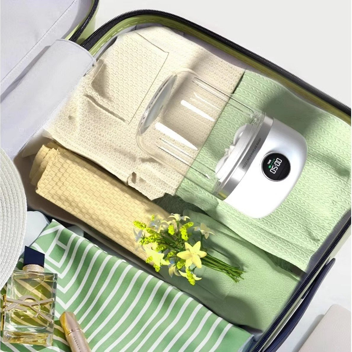 Mini rechargeable washing machine by Belro, compact outdoor laundry appliance with a white plastic body and control panel.
