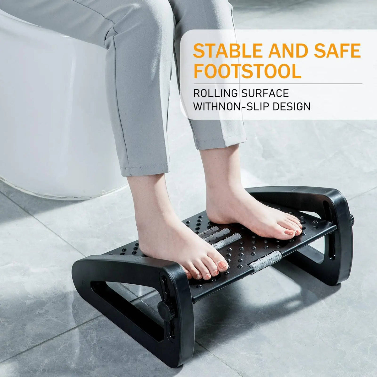 Belro under desk foot rest for ergonomic support, shown in a home office setting with a modern chair.