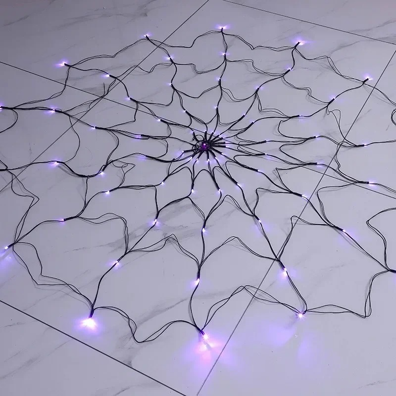Belro Halloween spider web lights outdoor accessory draped over an umbrella for spooky Halloween decor.