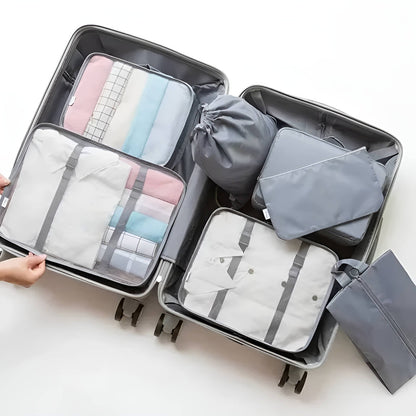 Set of seven Belro packing cubes for travel, organized fabric bags in various sizes for luggage organization and packing efficiency.