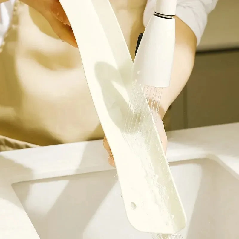 Belro silicone sink splash guard with suction cups, flexible kitchen accessory to prevent water splashes around the sink.