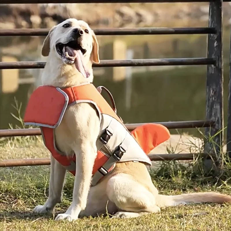 Belro dog float jacket with adjustable straps, bright orange color, and reflective safety strips for swimming and boating safety.